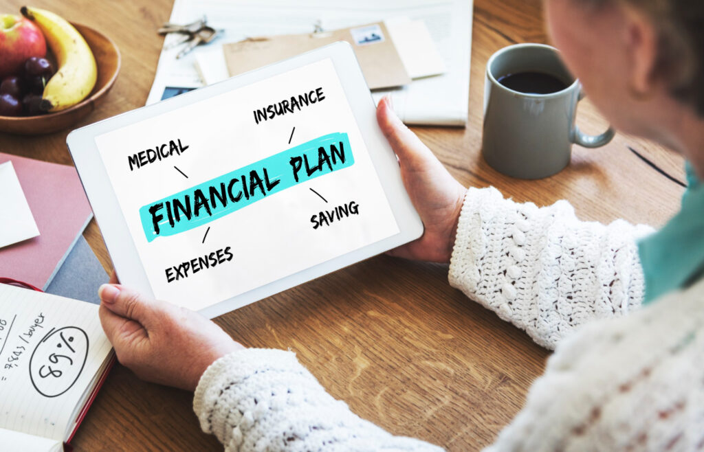 Building Wealth Is a Long Game Couple reviewing a long-term wealth building plan with a financial advisor in Canada